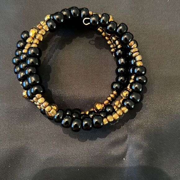 Gold and black beaded spiral bracelet this adjustable style fits all arm sizes - Picture 2 of 3